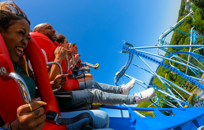 People riding Griffon roller coaster