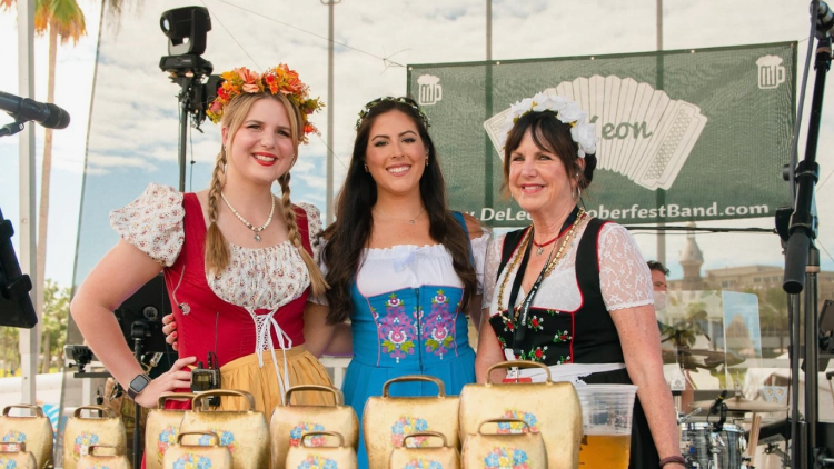 three girls cow bells