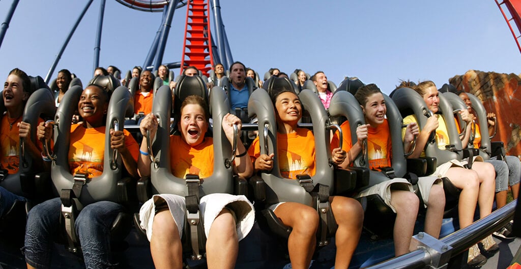 A large group of kids and teens riding a roller coaster at Busch Gardens Tampa Bay, located in Florida