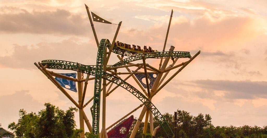 A long distance view of the yellow and green Cheetah Hunt roller coaster ride at Busch Gardens Tampa Bay, located in Florida.