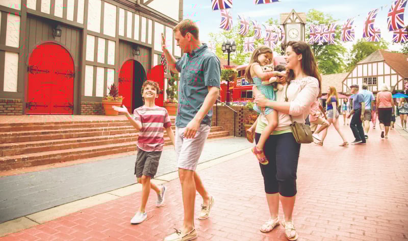 Family of four walking through Busch Gardens Williamsburg