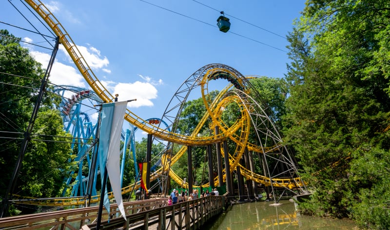 Bridge in front of a roller coaster