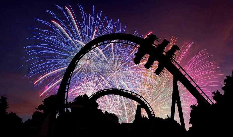 Fireworks behind a roller coaster