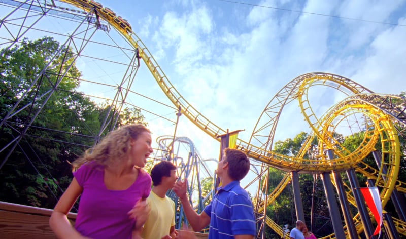 A family in front of Loch Ness Monster Roller Coaster
