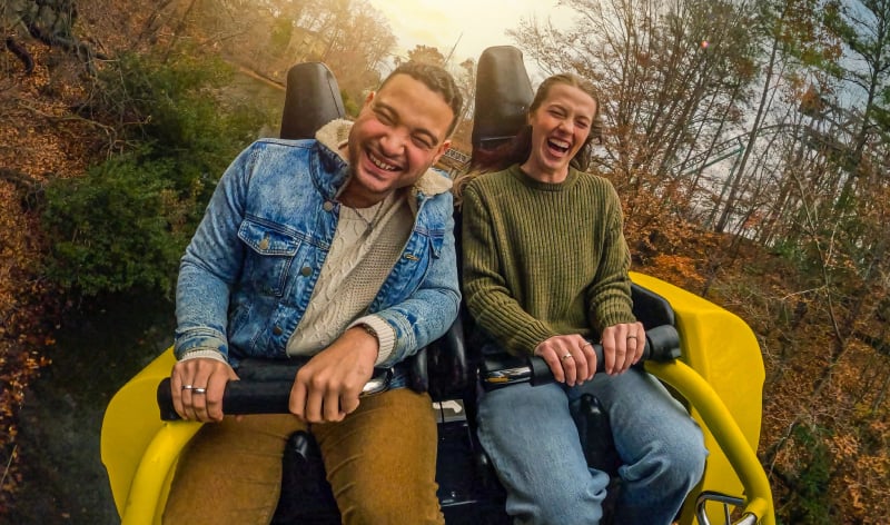 Two people on a roller coaster