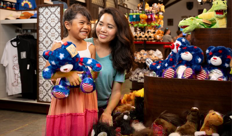 Mother and daughter shopping for teddy bears