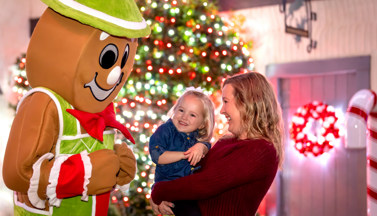 Woman and child meeting Gingy at Busch Gardens Williamsburg Christmas Town