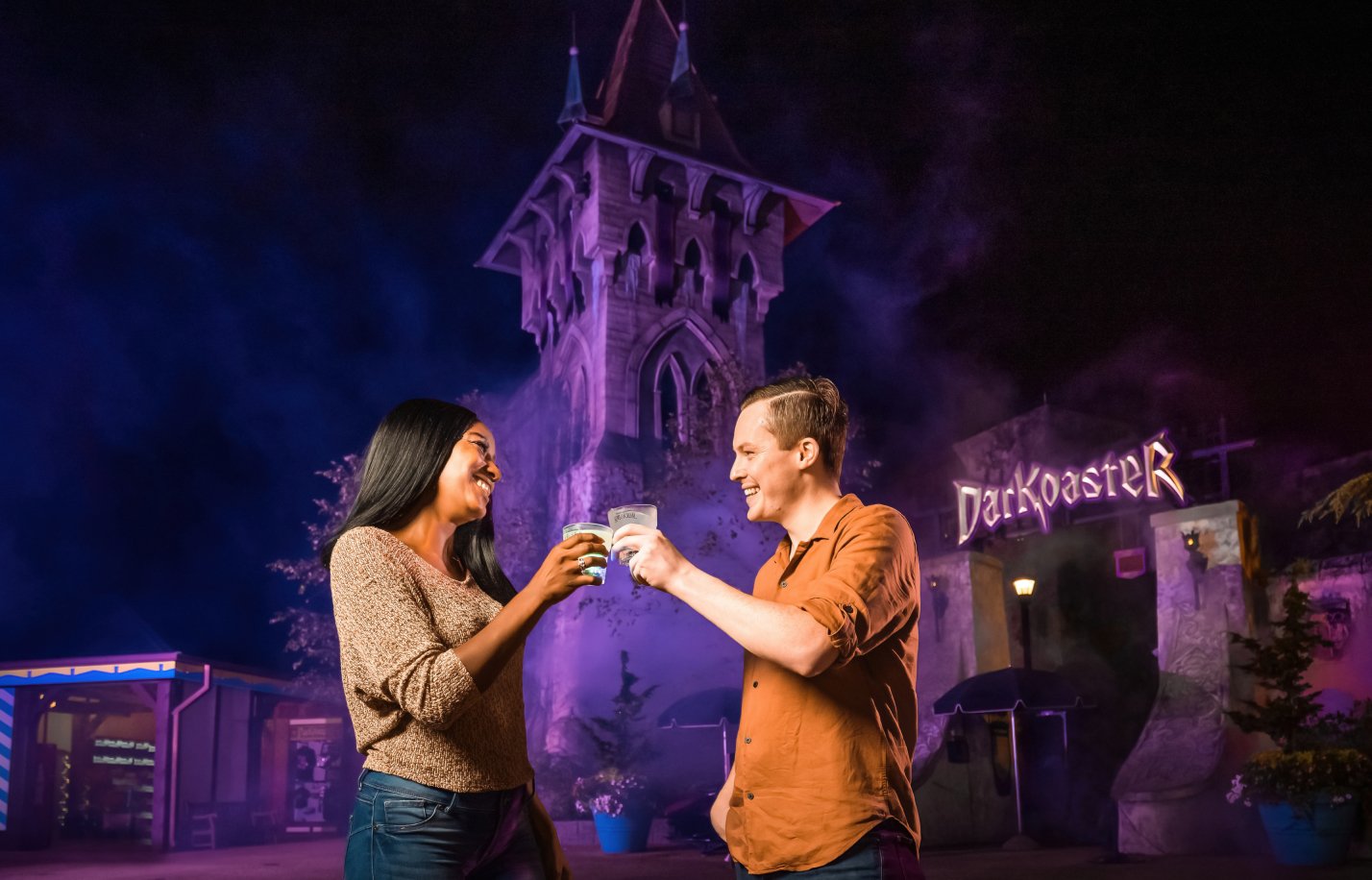 Guests in front of DarKoaster with drinks