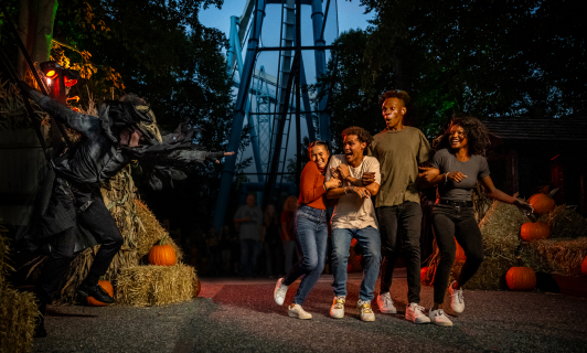 Family getting scared by a Halloween actor