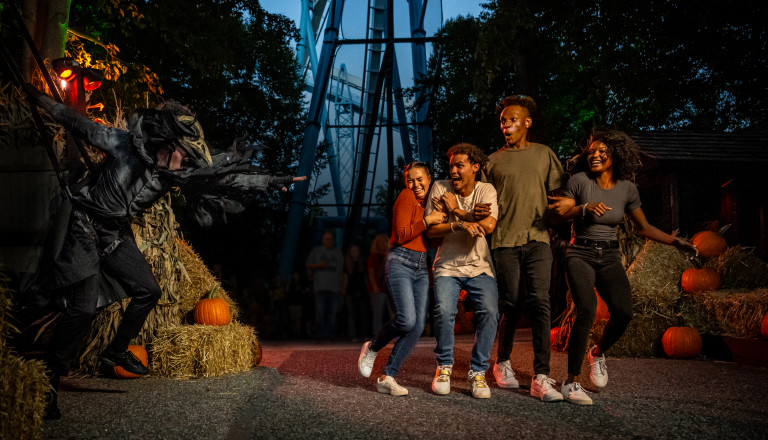 Family getting scared by a Halloween actor
