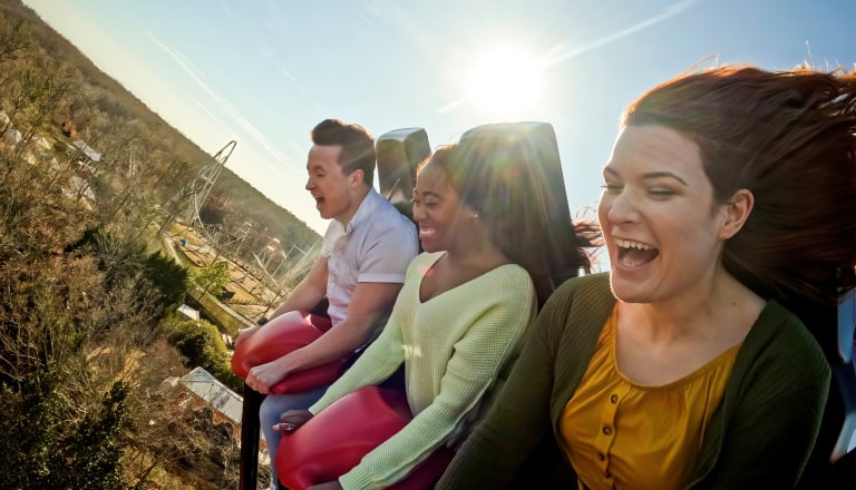 Guests enjoying a ride on the Apollo’s Chariot hypercoaster at Busch Gardens Williamsburg.