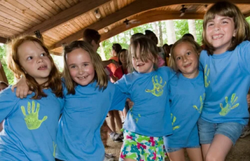 Four girls in camp shirts