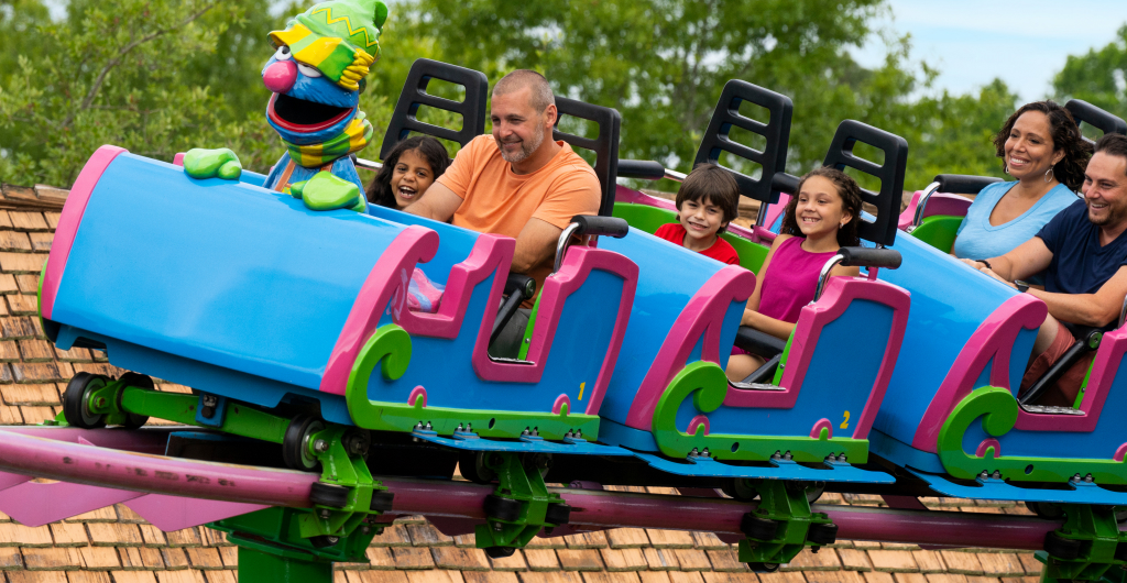 People on Grover's Alpine Express roller coaster