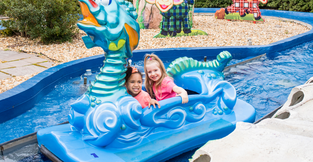 Two children on a kid friendly water flume ride