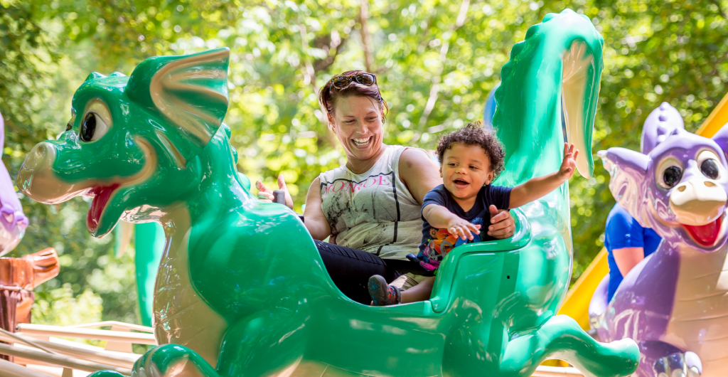 An adult and child riding Flutter Sputter at Busch Gardens Williamsburg