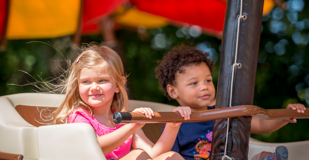 Two children riding The Little Gliders at Busch Gardens Williamsburg