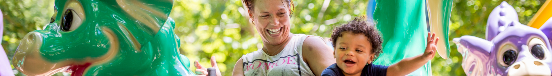 An adult and child riding Flutter Sputter at Busch Gardens Williamsburg