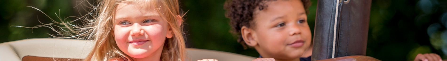 Two children riding The Little Gliders at Busch Gardens Williamsburg