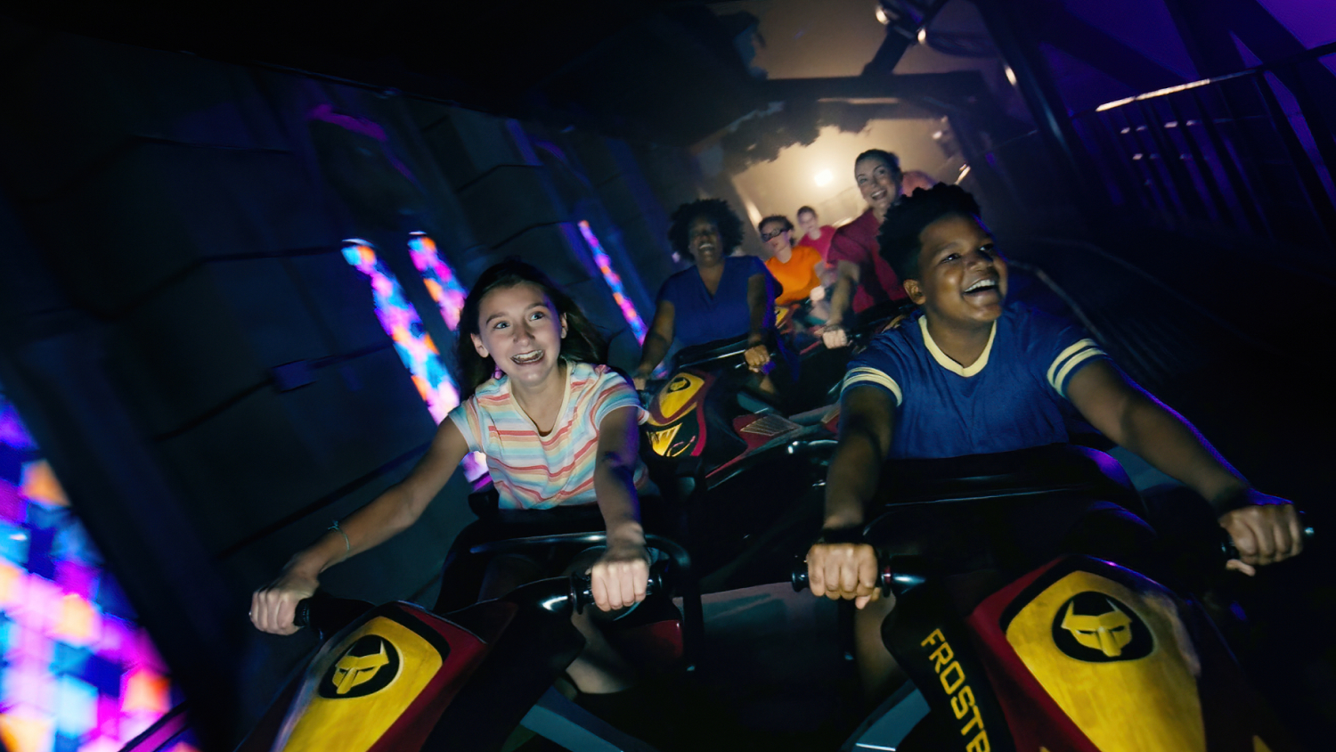 Kids riding DarKoaster™ at Busch Gardens Williamsburg.