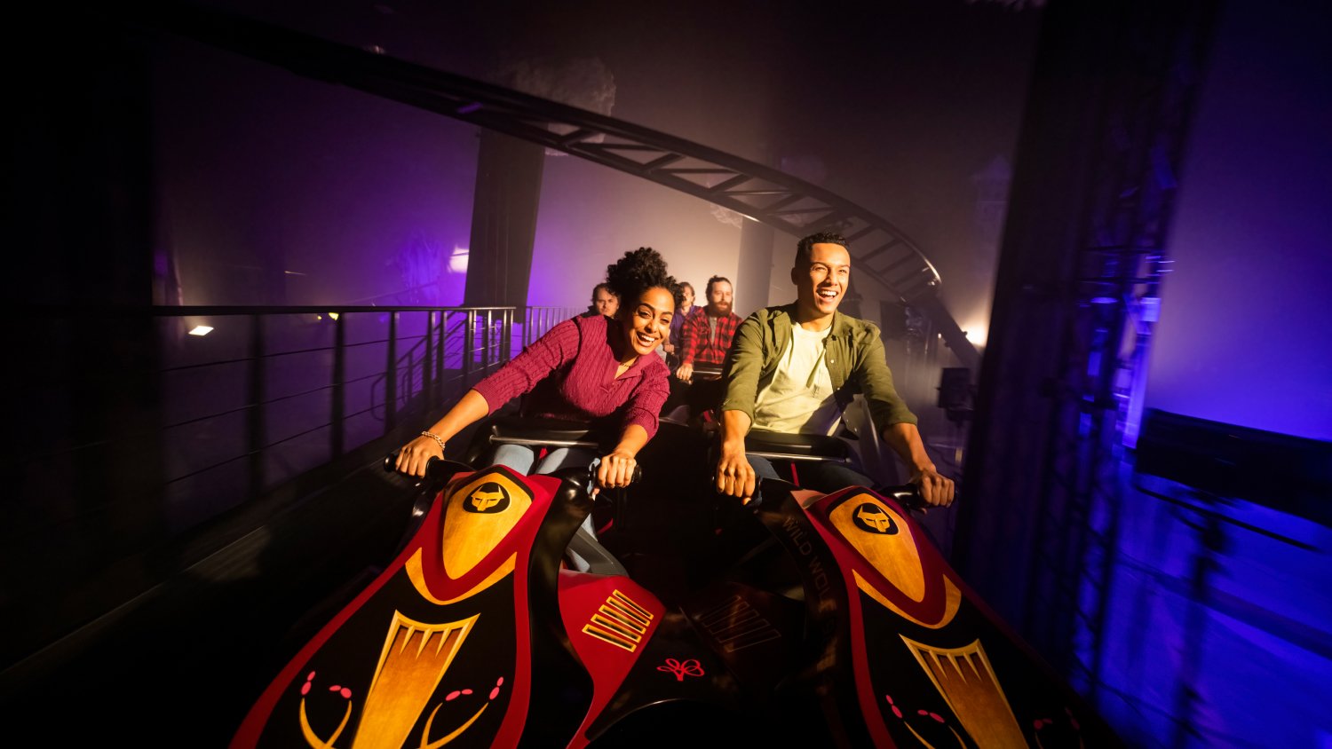 Adults enjoying riding DarKoaster™ at Busch Gardens Williamsburg.