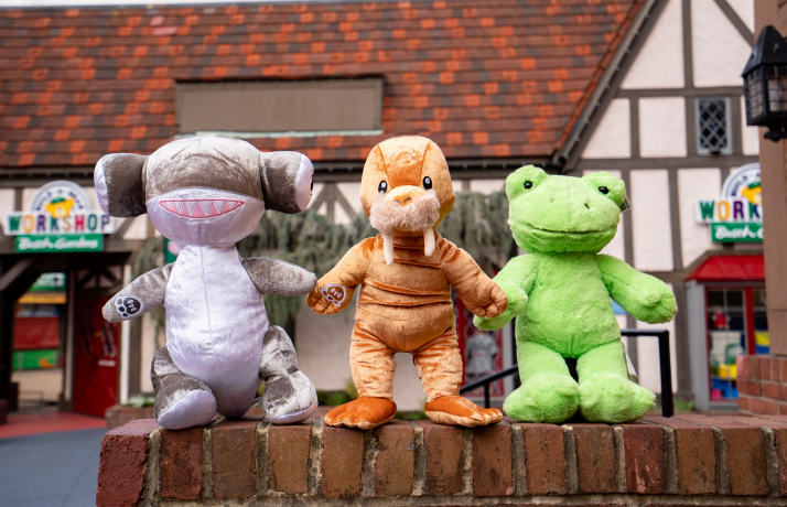 three stuffed animals lined up