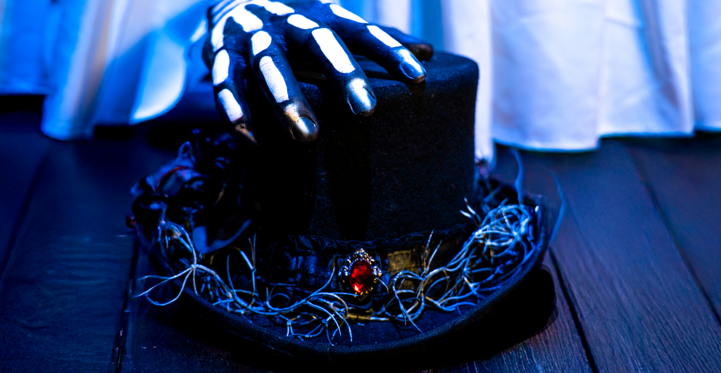Skeleton hand on a top hat