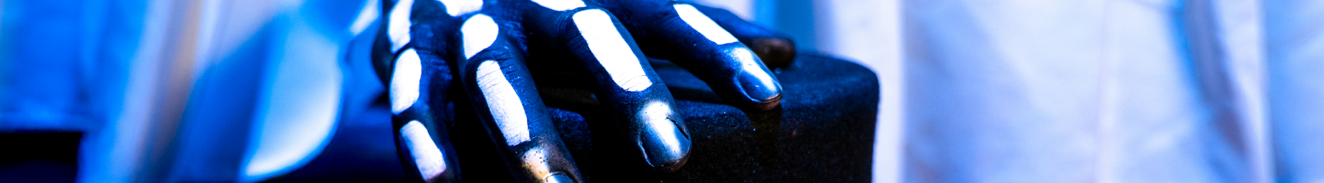 Skeleton hand on a top hat