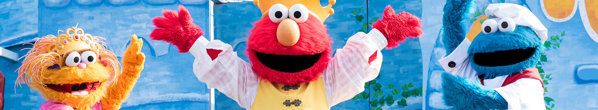 Zoe, Elmo, and Cookie Monster dressed in costumes