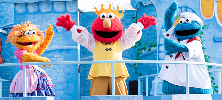 Zoe, Elmo, and Cookie Monster dressed in costumes