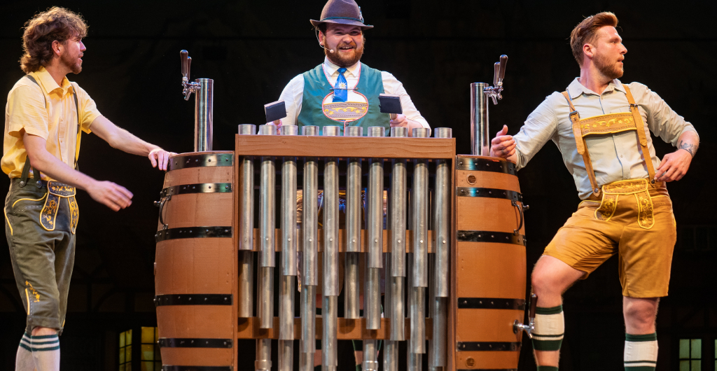 Three entertainers on stage for We Are Oktoberfest at Busch Gardens Williamsburg