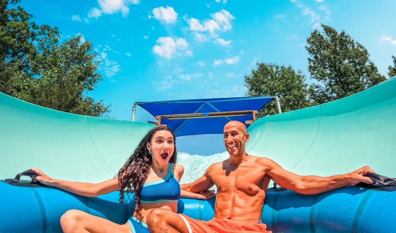 Two people on a water slide