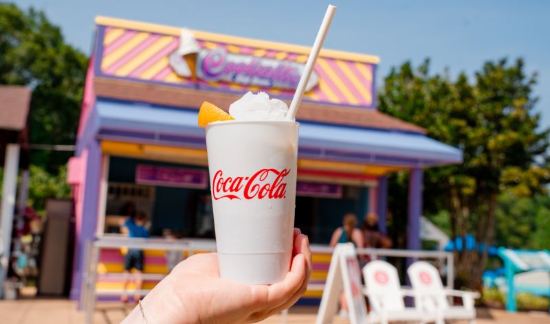 Coca-Cola Orange Float in front of a cabin