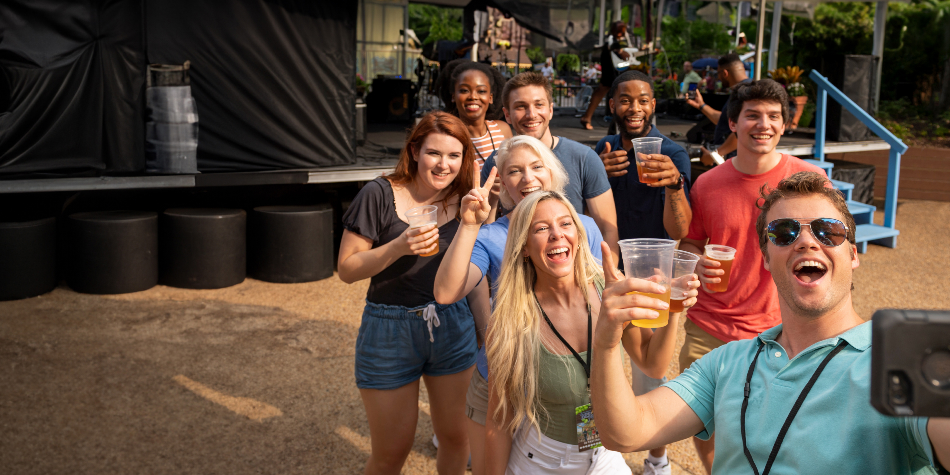 A group of friends enjoying live local bands at Busch Gardens Williamsburg Bier Fest.