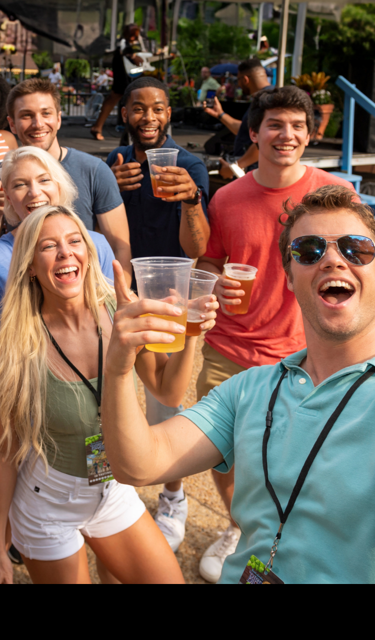 A group of friends enjoying live local bands at Busch Gardens Williamsburg Bier Fest.