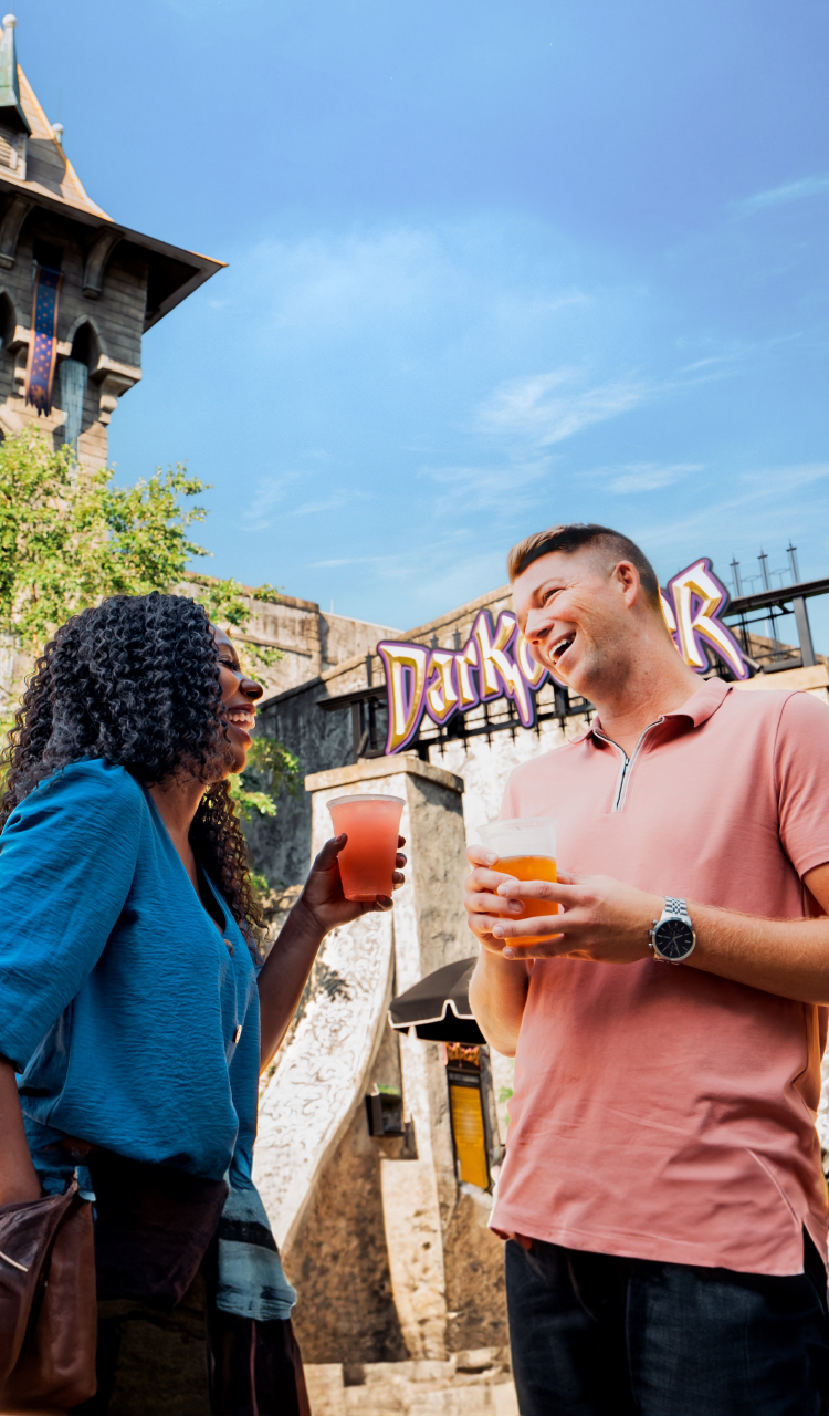 Two friends enjoying some thrills on tap at Busch Gardens Williamsburg Bier Fest.