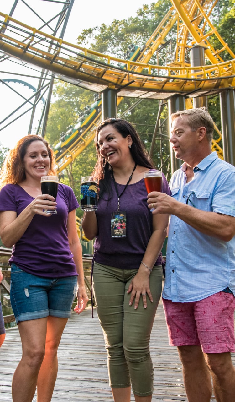 Friends enjoying delicious bites at Busch Gardens Williamsburg Bier Fest.