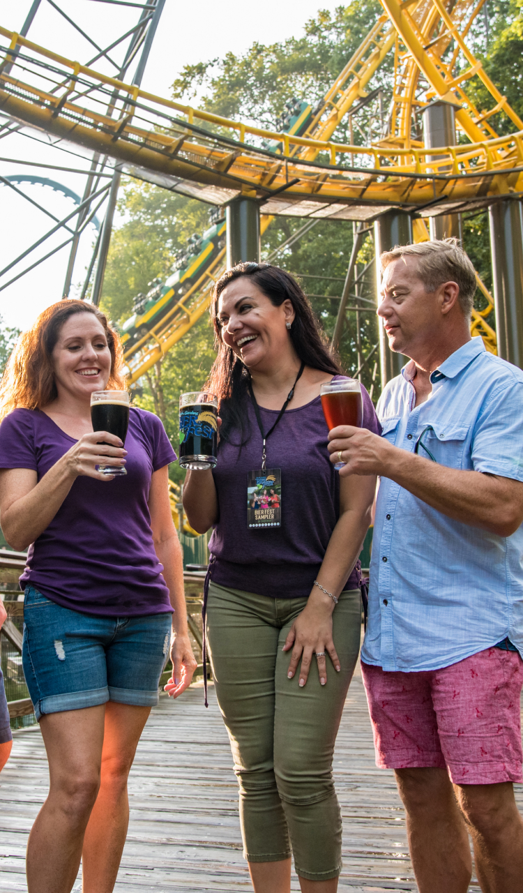 Friends enjoying delicious bites at Busch Gardens Williamsburg Bier Fest.