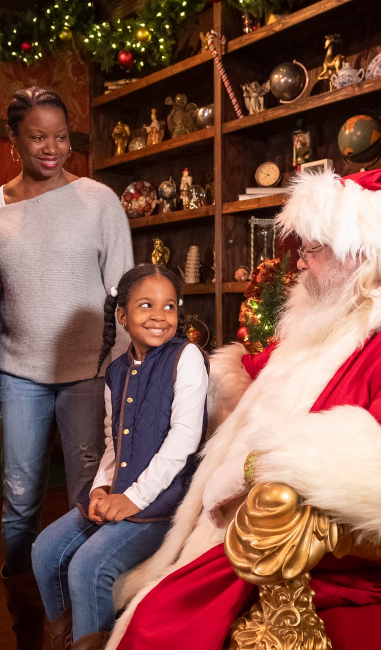 Family meeting Santa Claus at Busch Gardens Williamsburg Christmas Town event.