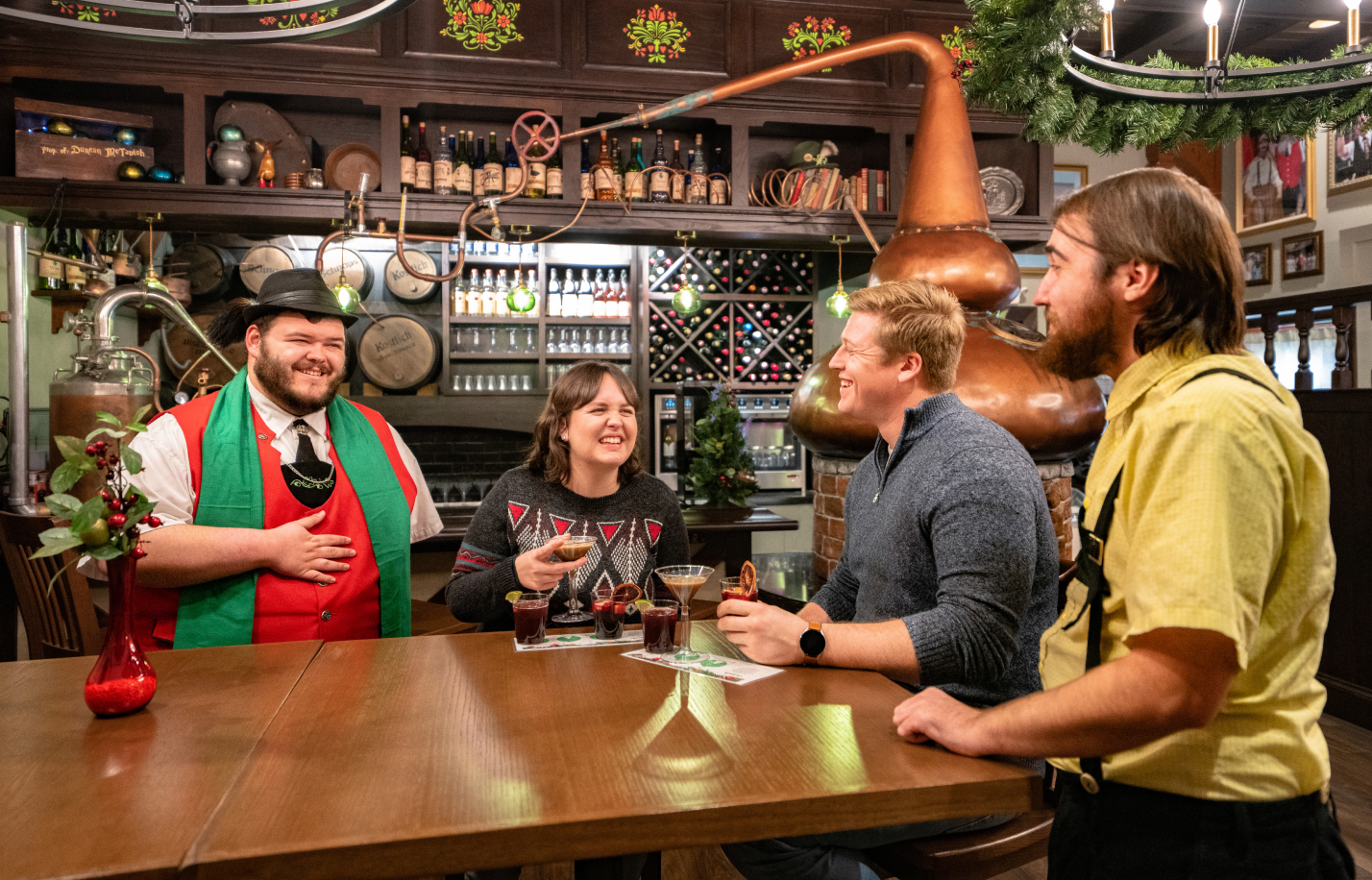 People enjoying the Bürgermeister's Hideaway Christmas Town specialty menu at Busch Gardens Williamsburg.