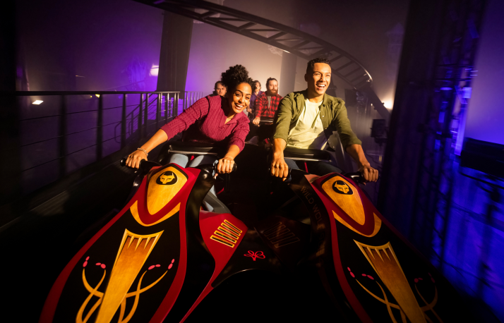 Busch Gardens Williamsburg guests riding the Dive Roller Coaster Griffon at night during Howl-O-Scream.