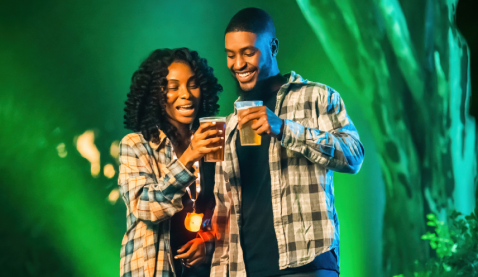 Two enjoying a drink during Howl-O-Scream at Busch Gardens Williamsburg.