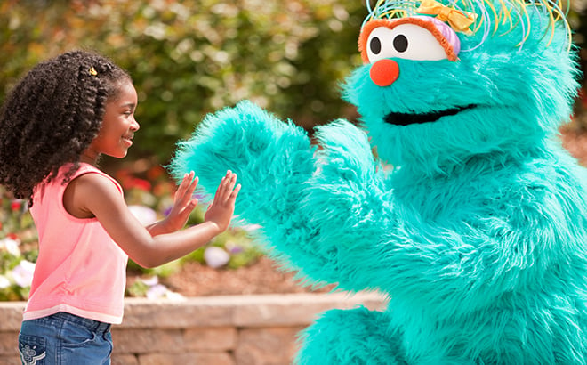 Rosita plays patty cake with a new young friend at Busch Gardens Williamsburg Sesame Street Kids Weekends