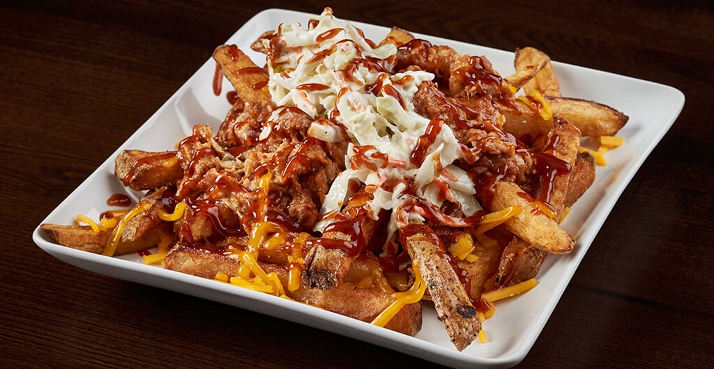 Enjoy a loaded batch of fries with a refreshing Coca-Cola® beverage or a beer on tap.