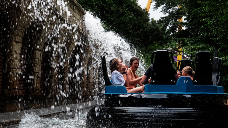 Friends enjoying getting soaked on Roman Rapids during Busch Gardens Williamsburg Summer Nights.