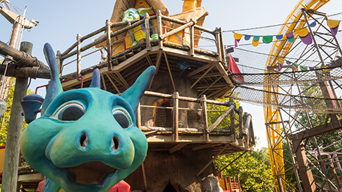 Land of the Dragons include a tree house, climbing ropes, slides, water play area and kids rides